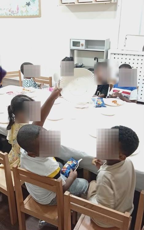 Children enjoying snacks together at our Eid party