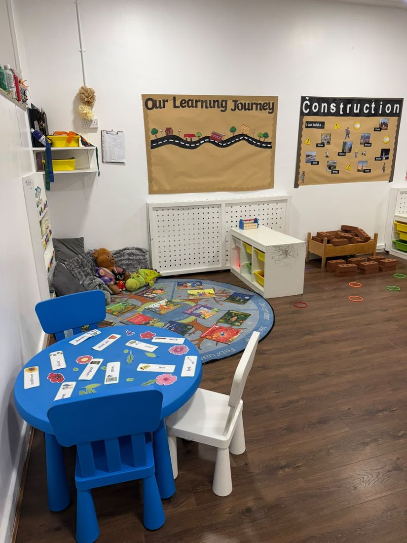 Our preschool room with a learning journey display and activity table